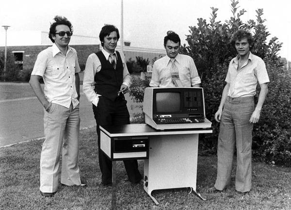 The Micral C microcomputer pictured with design team