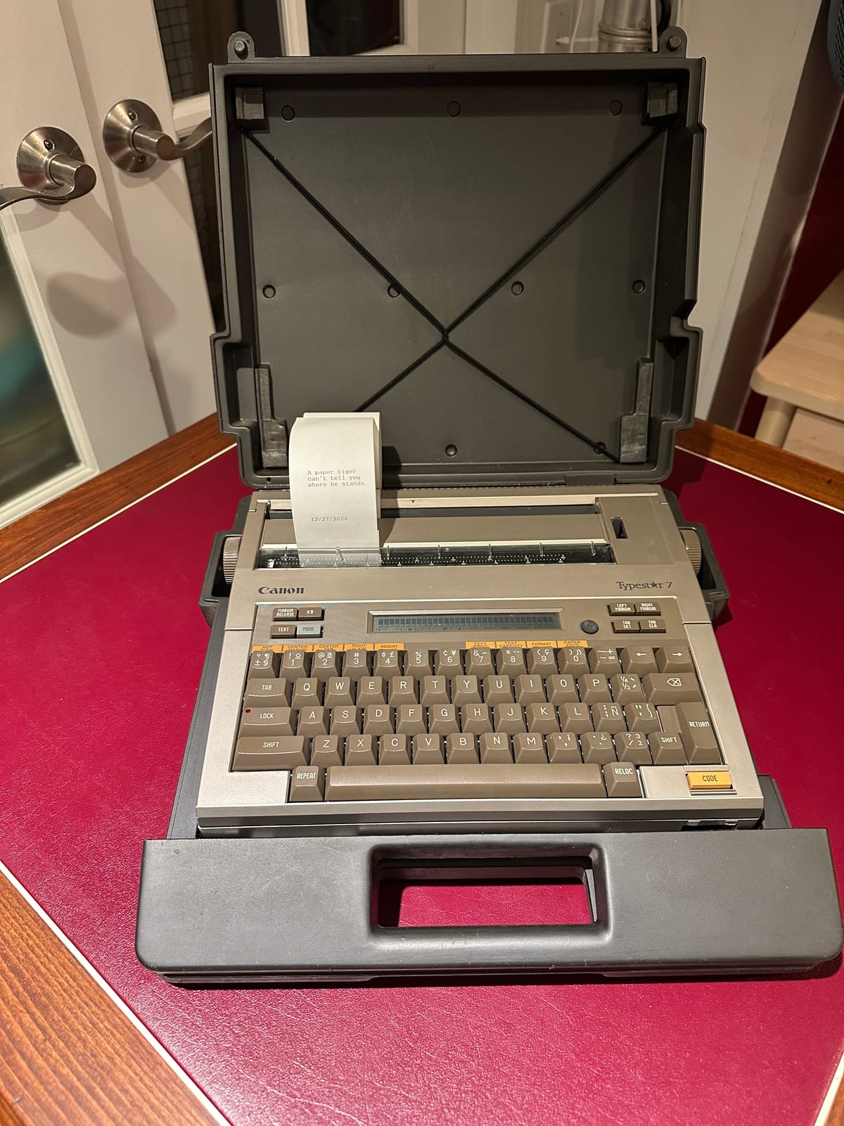 A Canon Typestar 7 typewriter in its travel case.